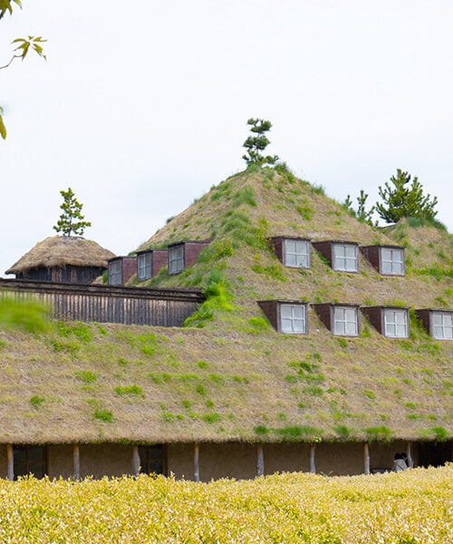 michele de lucchi & terunobu fujimori's grass-veiled la collina echoes its hilly surroundings