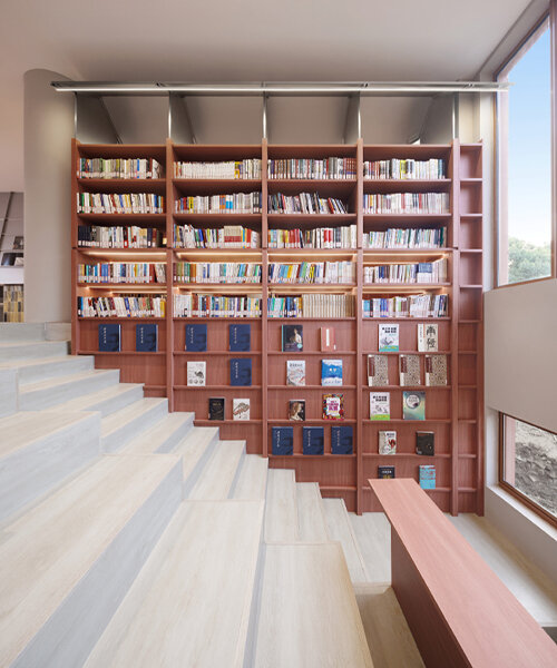 li city study invites 24/7 reading amid a terracotta-hued & skylit backdrop in china