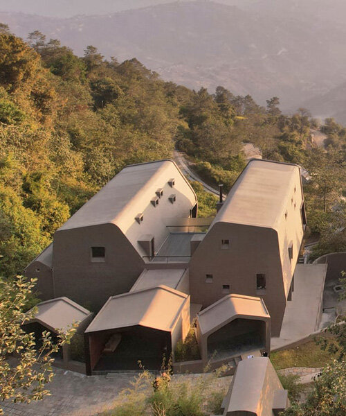 MAP's cloud catcher emerges from nepal hillside resort as two rock-like volumes