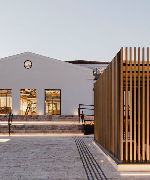 flexible wooden modules attach to revitalized market's original metal trusses in spain